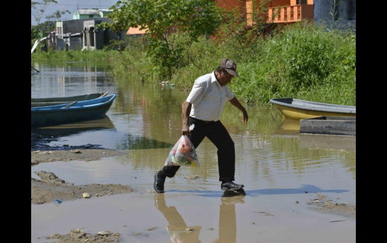 Cerca de 80 mil 737 personas fueron afectadas por las inundaciones generadas por el desbordamiento de ríos. ARCHIVO /