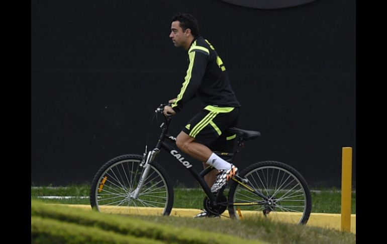 Xavi tiene contrato hasta 2016, pero el cambio de técnico provocaría su salida. AFP /