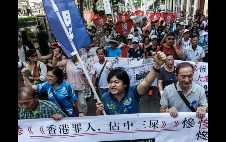 Estudiantes y activistas pro-democracia demandan que en China se celebren elecciones completas, libres y justas para 2017. AFP / A. Wallace