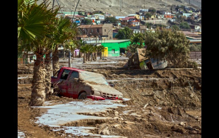 El atípico temporal en la zona desértica del norte de Chile ha causado hasta ahora la muerte de 23 personas. AFP / P. Miranda
