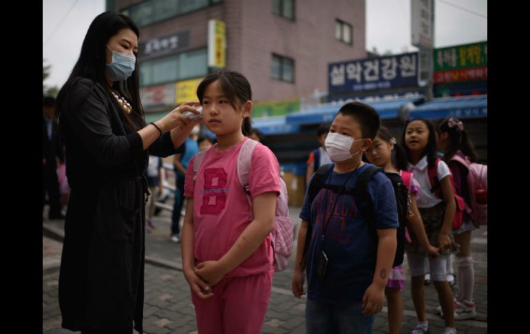La epidemia afectó al crecimiento de la cuarta economía asiática. AFP / ARCHIVO
