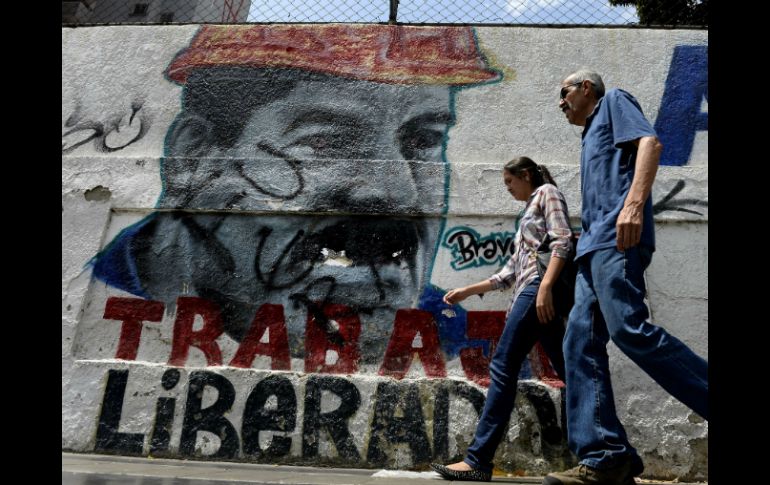 HRW dice que el gobierno de Maduro ha detenido, amenazado o acusado de cargos criminales a quienes lo han criticado. AP / ARCHIVO