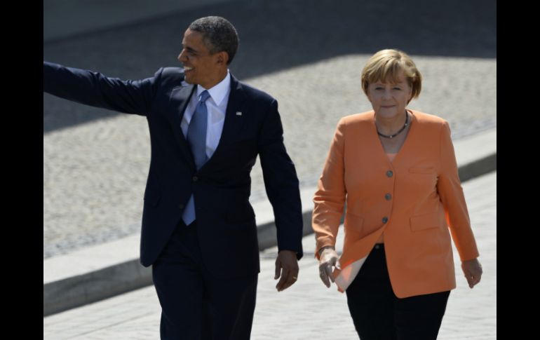 Obama agradeció a Merkel su 'liderazgo' en la búsqueda de soluciones a la crisis migratoria en Europa. AFP / ARCHIVO