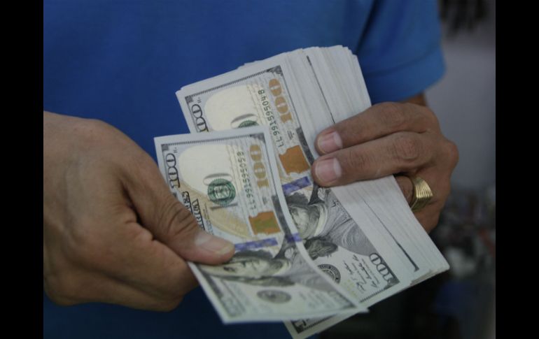 El Banco de México informa que el tipo de cambio para solventar obligaciones se ubida en 18.4118 pesos. EL INFORMADOR / ARCHIVO