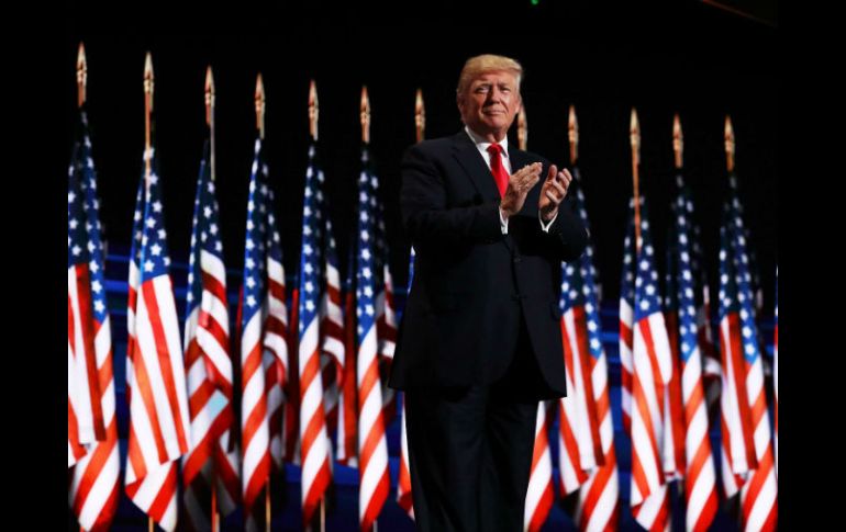 Trump fue recibido con vítores y una ovación de pie en Cleveland, donde republicanos culminan cuatro días de convención partidista. AFP / J. Raedle