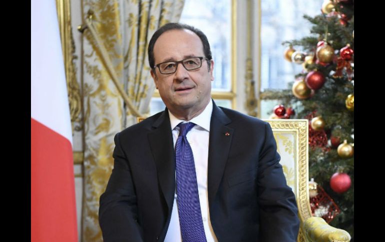 'Iré a expresar directamente a Merkel mi apoyo esta tarde', declaró Hollande. EFE / J. Lempin