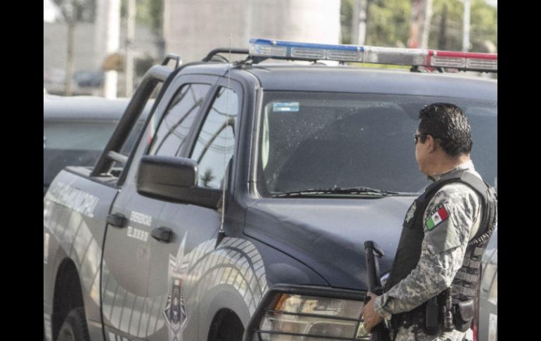 Elementos de la policía de Michoacán acudieron al lugar para resguardar la escena del crimen. EL INFORMADOR / ARCHIVO