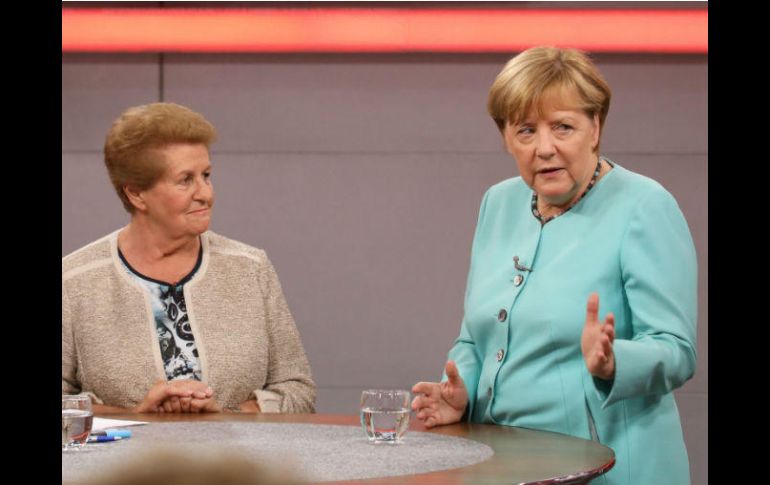 En un programa de la cadena RTL, Merkel Invitó a todos a ‘dar su voto aquí, en un país libre’. AFP / A. Friese